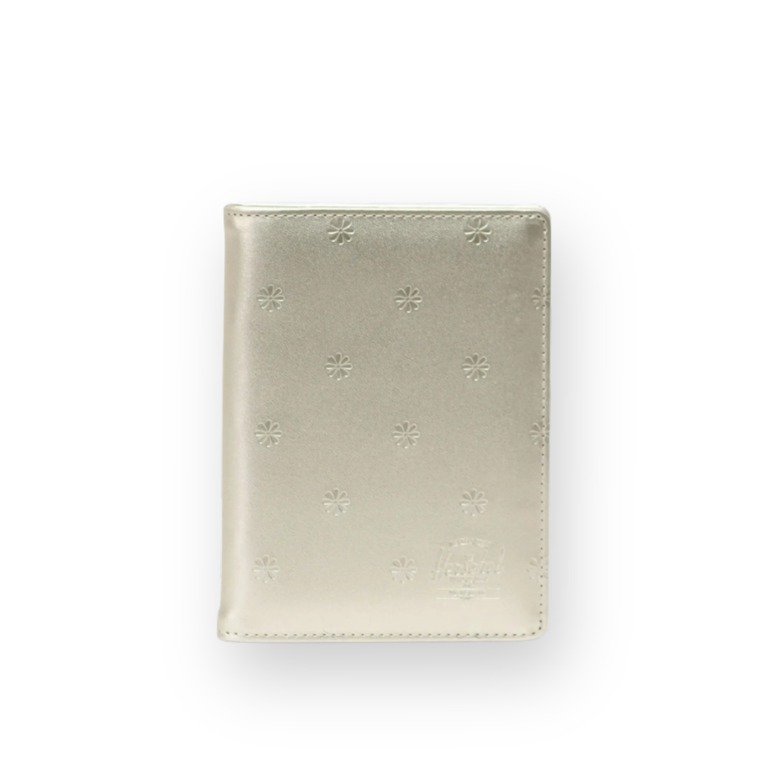 HERSCHEL - RAYNOR PASSPORT HOLDER IN CHAMPAGNE METALLIC FLORAL VEGAN LEATHER